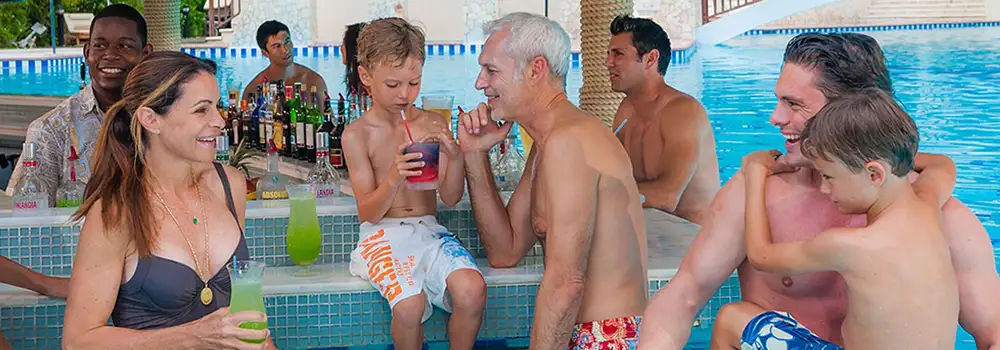 A family at an all inclusive resort pool (c)Sandals