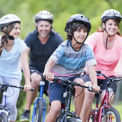 A family biking through the countryside