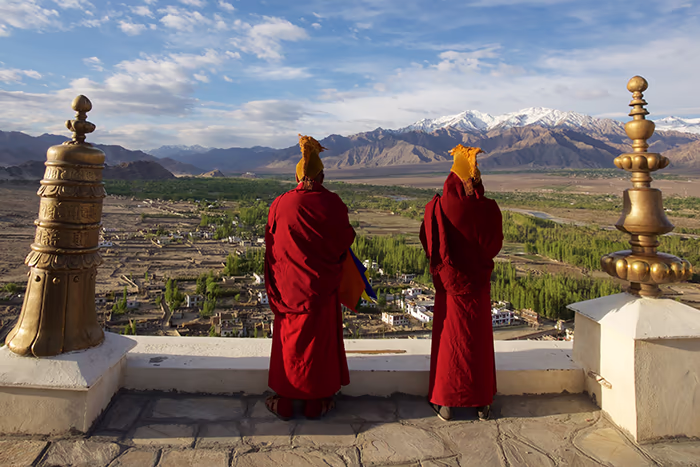 Two monks looking over the horizon