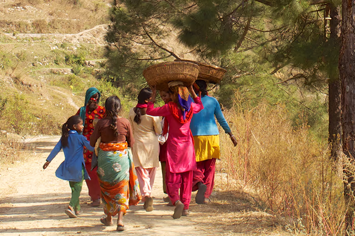 Villagers walking along a trail