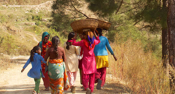 Villagers walking along a trail