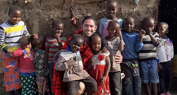 Man with Kenyan kids