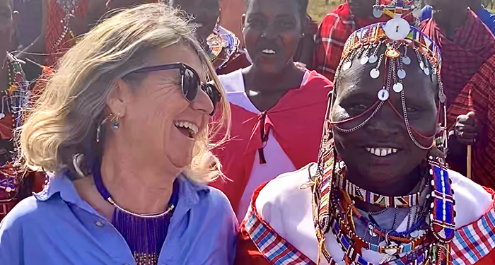 Woman laughs with Masaii Mari woman