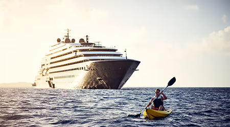 Luxury cruise ship with kayaker