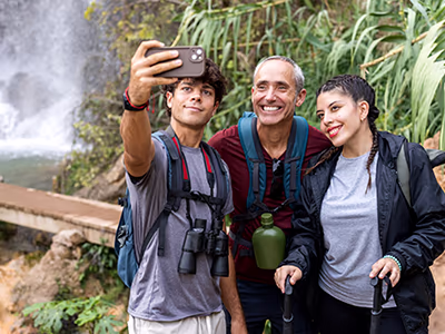 Teens taking a selfie with grandfather