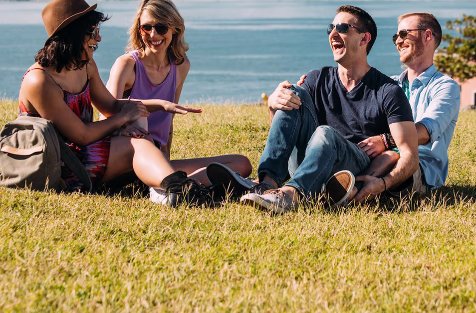 A gay couple and a lesbian couple laughing in Puerto Rico, the most LGBTQ friendly island in the Caribbean