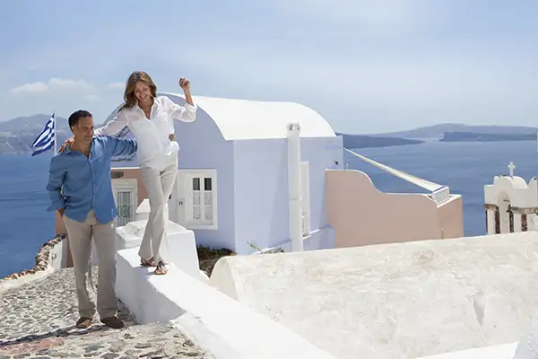 A couple explores Santorini, Greece on a Regent Seven Seas cruise
