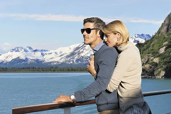 A couple embraces on a Regent Seven Seas cruise in Alaska