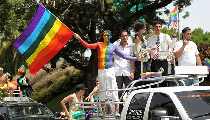 A young man in rainbow body paint at the Puerto Rico Pride parade