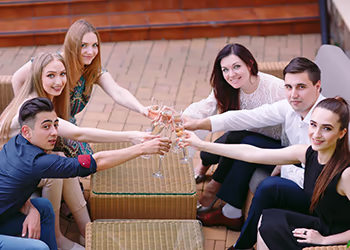 A business team celebrates with wine