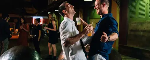 A gay couple dancing in the street