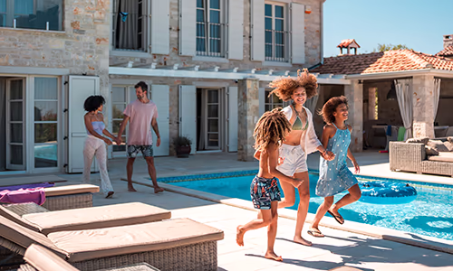 A family is excited to settle in at their villa