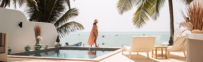Woman walking along a private pool